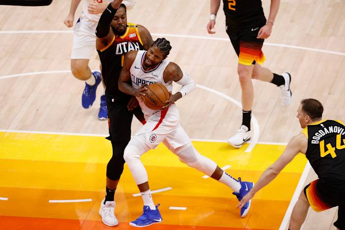 Jun 8, 2021; Salt Lake City, Utah, USA; LA Clippers guard Paul George (13) drives to the hoop against Utah Jazz center Derrick Favors (15) in the fourth quarter during game one in the second round of the 2021 NBA Playoffs. at Vivint Arena. Mandatory Credit: Jeffrey Swinger-USA TODAY Sports